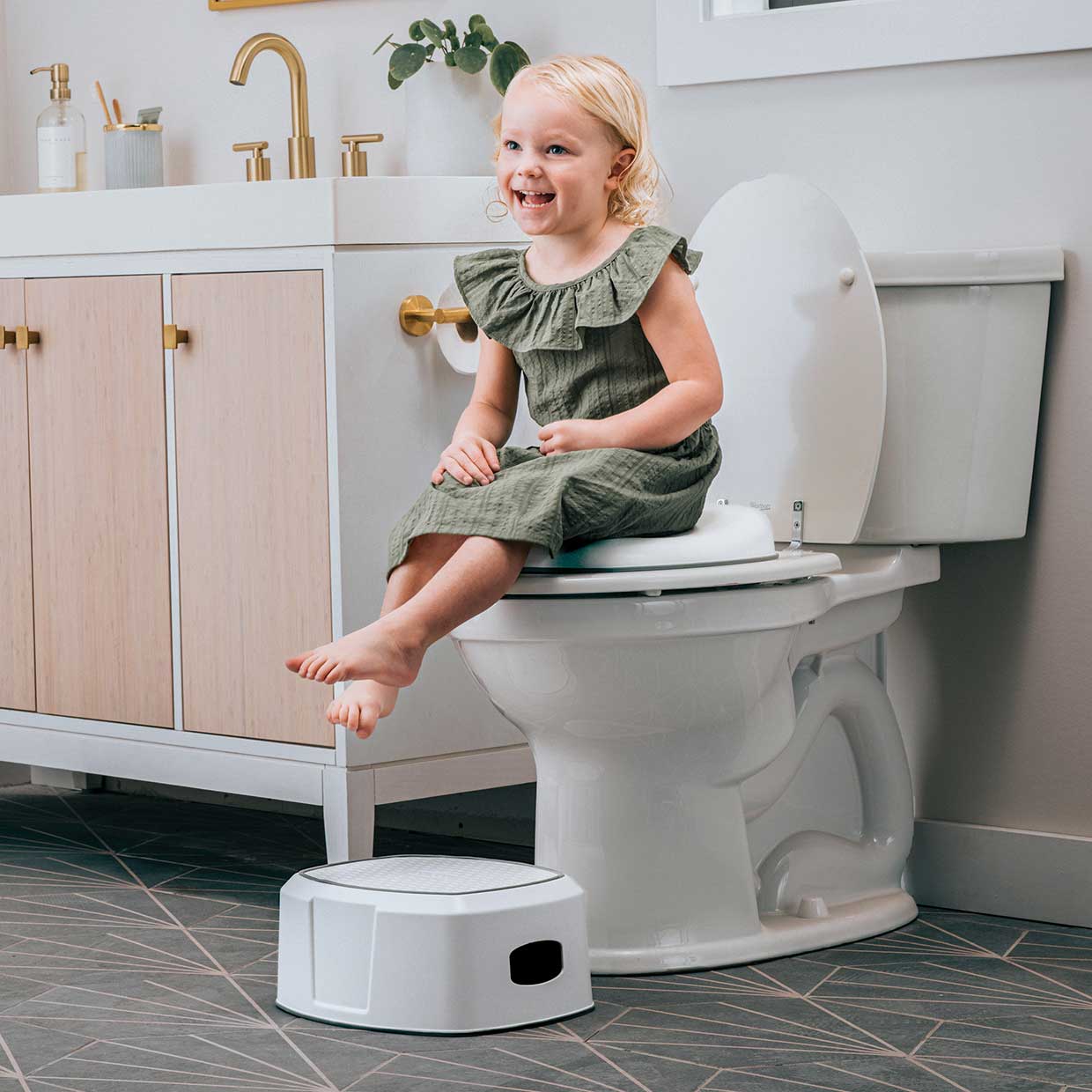 Child using the Chicco 3-in-1 Potty Training System