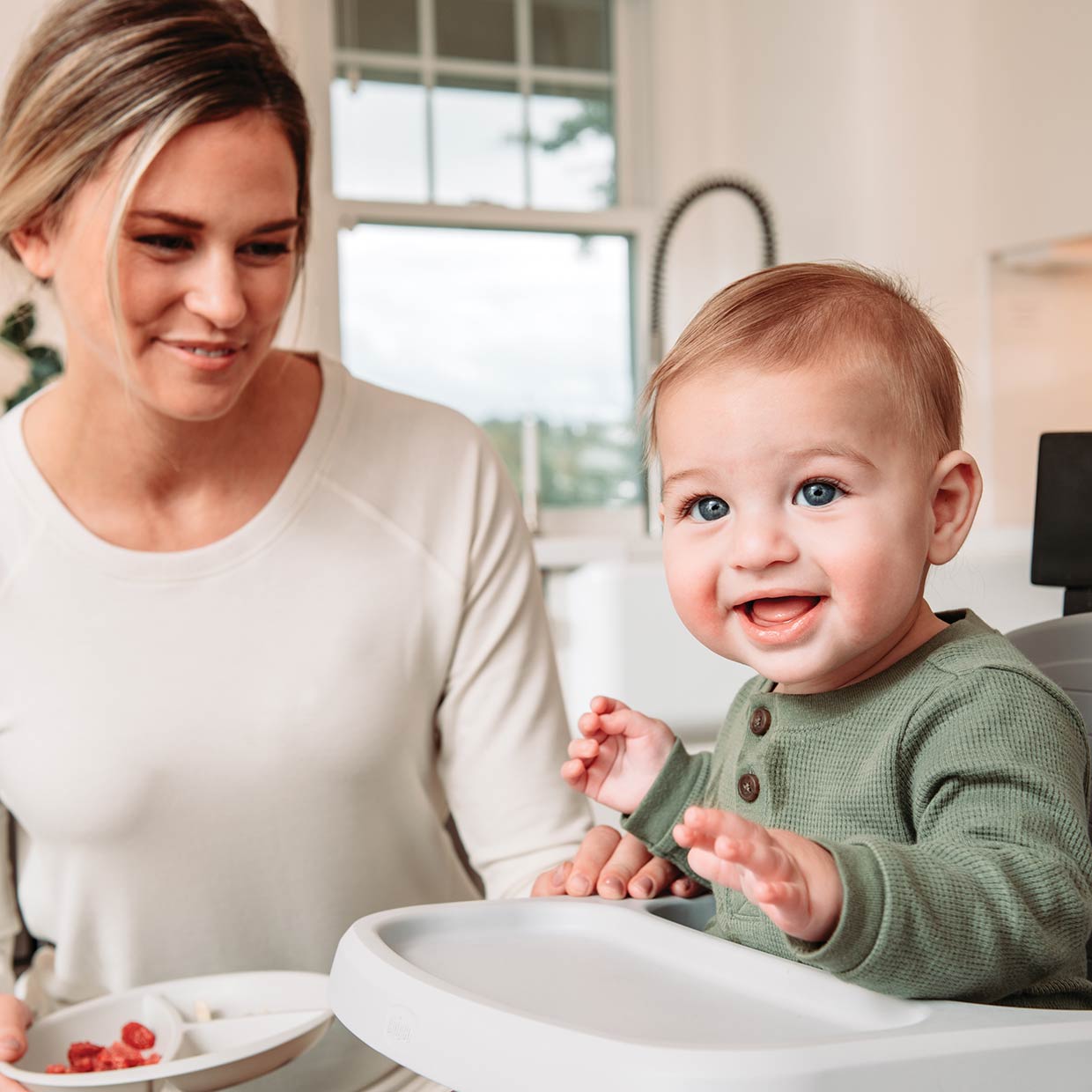 Mom with child in Chicco Bento Booster Seat image