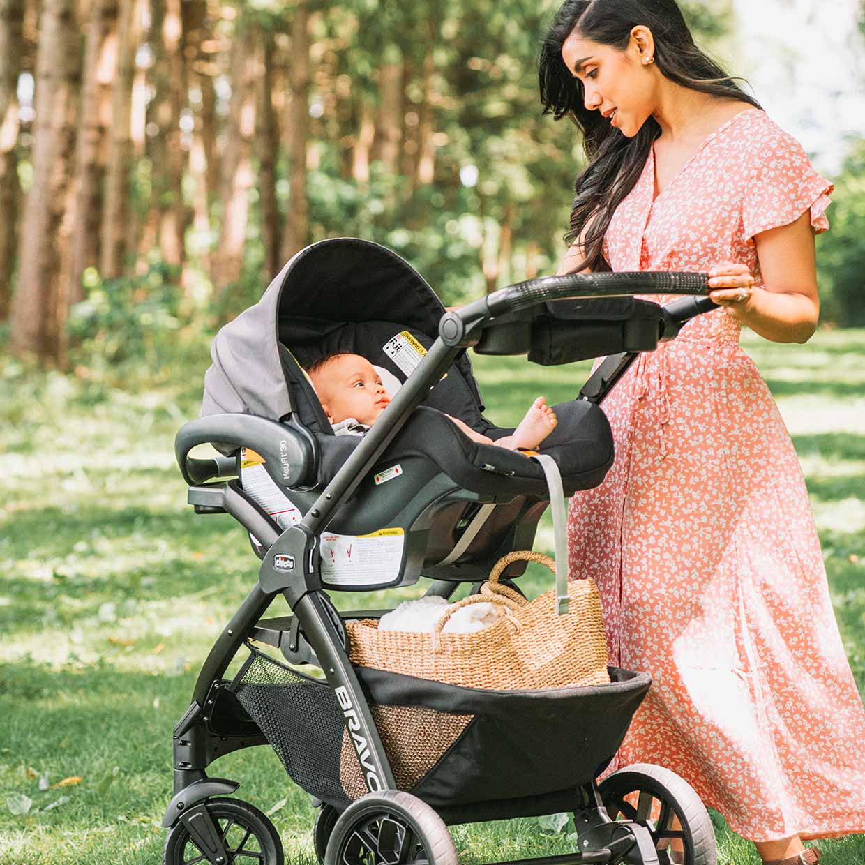 Newborn infant outside in Chicco KeyFit 30 ClearTex Car Seat with stroller image
