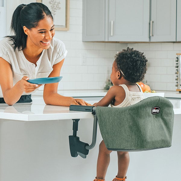 FastLock Hook-On Chair attached to table with child