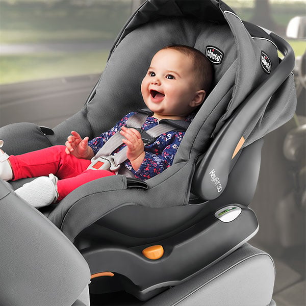 Infant sits rear-facing in a KeyFit 30 Infant Car Seat while riding in a car
