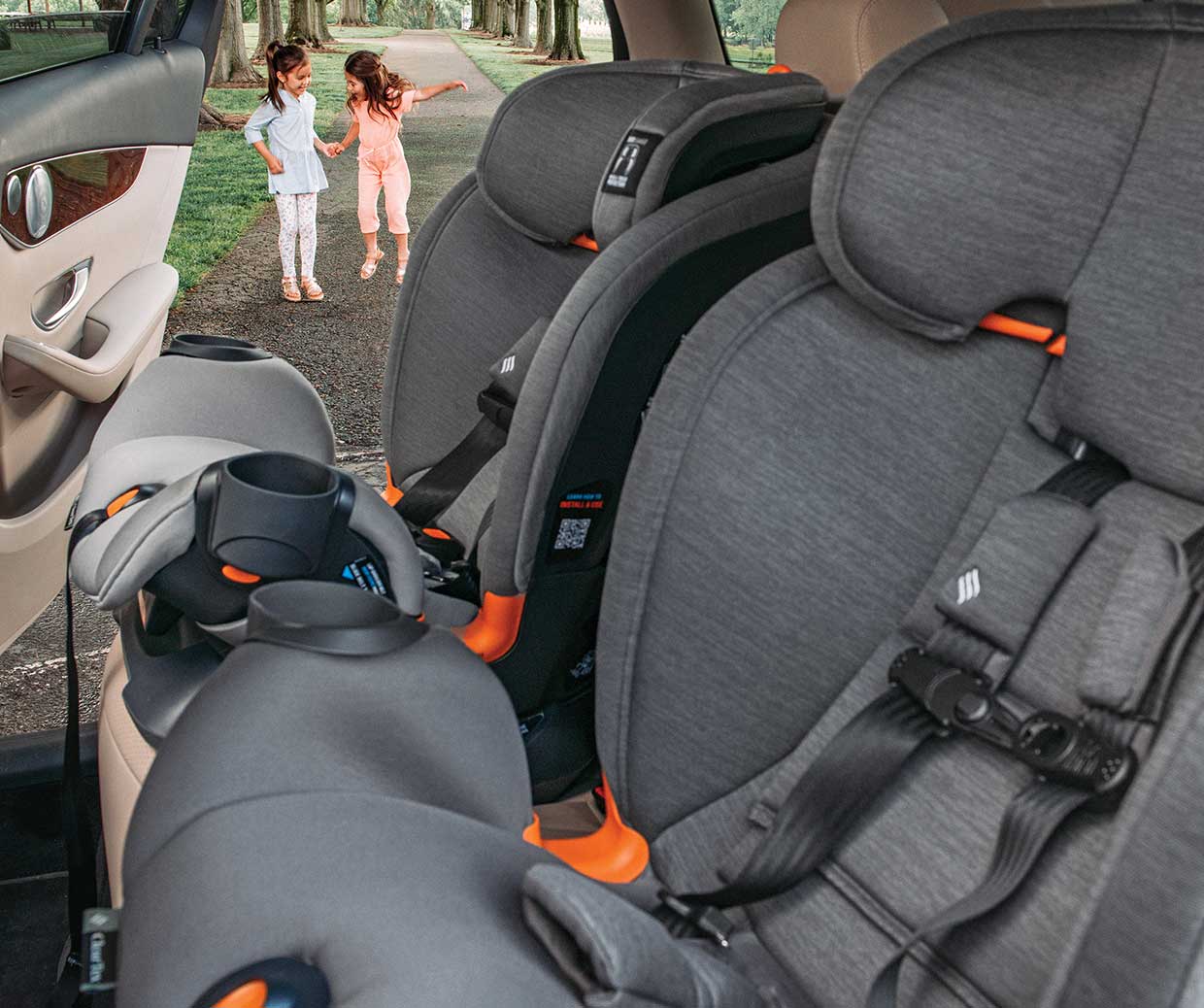 Chicco OneFit All-in-One car seat installed forward-facing in a vehicle.