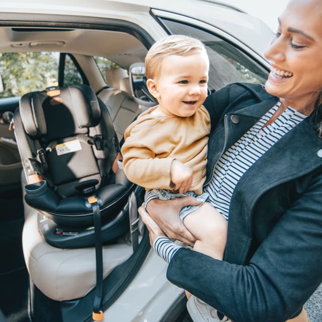 Chicco Fit360 Rotating Car Seat with Mother holding Child
